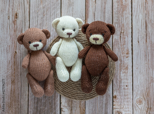 Soft toy bear on a wooden background.