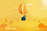 Businessman with telescope in hot air balloon searching for opportunities.Successful and business concept.