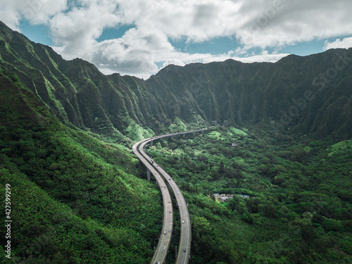 Aerial view of Oahu highway between the mountain of Hawaii. Road to Heaven.
