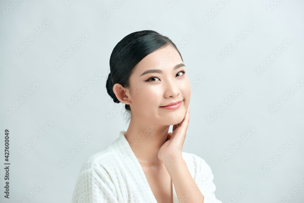 Beautiful smiling woman with clean skin, natural make-up on white background Beautiful smiling woman with clean skin, natural make-up on white background