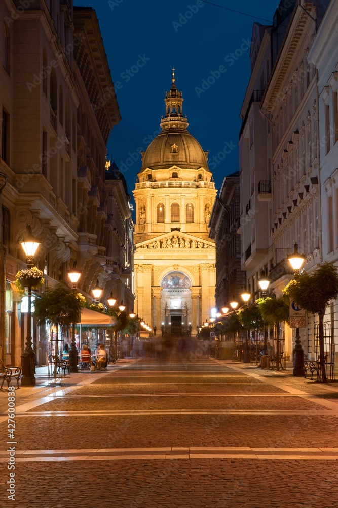Budapest historical city center, picturesque streets to Saint Stephen basilica in Budapest, Hungary night time blue hour.
