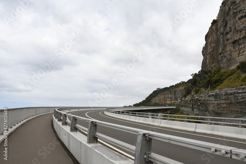 Beautiful shot of the Sea Cliff Bridge in Australia on background of the cloudy sky