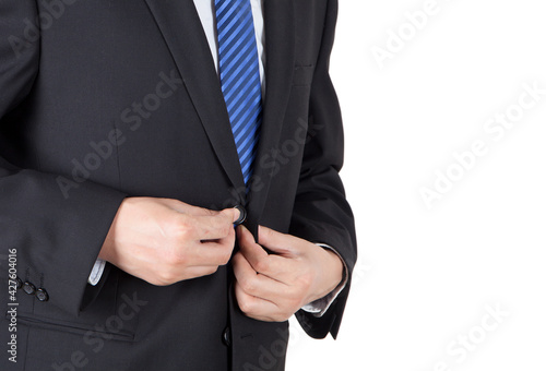 A man who fastens his suit