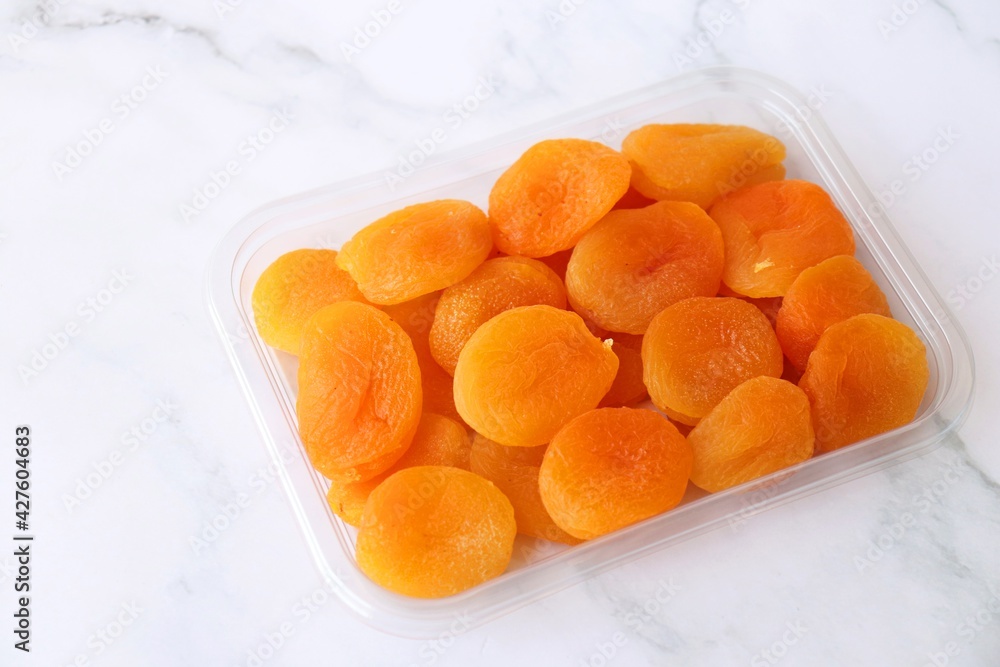 Dried apricots on white background with copy space. dried organic apricots. Dried apricots on white background with copy space. dried organic apricots.