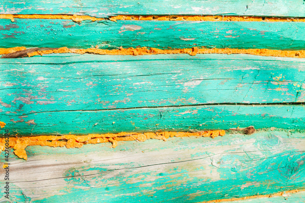 The wall of an old wooden painted house The wall of an old wooden painted house