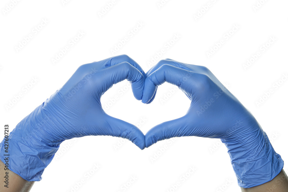 Obraz premium Hands in medical gloves shows heart, isolated on white background