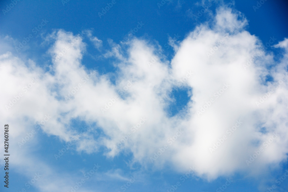 white fluffy clouds in a blue sky white fluffy clouds in a blue sky