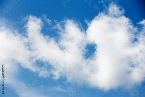 white fluffy clouds in a blue sky