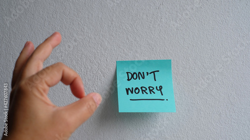 'Don't worry' message concept written post it.