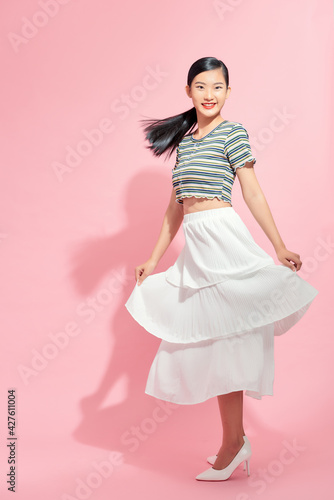 Pretty girl spinning some motion blur in her skirt
