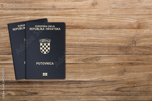 Croatian passport on a dark wooden background