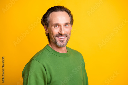 Wallpaper Mural Photo of cheerful positive guy look camera shiny white smile wear green sweater isolated vibrant yellow color background Torontodigital.ca