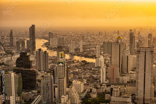 Bangkok city skyline with sunset over the Chao Phraya river
