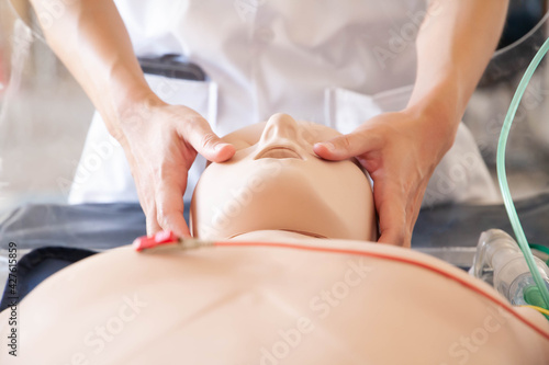 Demonstration of jaw thrust maneuver on manikin.
Concept of resuscitation, open airway for trauma patient. Selective focus