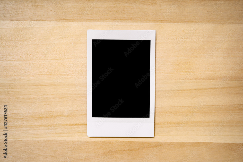 instant photo frame on wood background instant photo frame on wood background