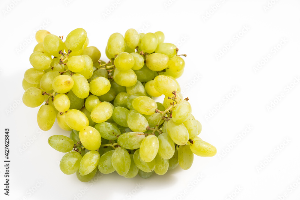 ripe green grapes on a white background. sweet juicy berries. Farm organic products ripe green grapes on a white background. sweet juicy berries. Farm organic products