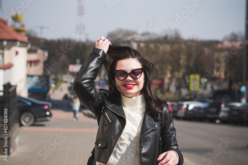 Outdoor lifestyle portrait of pretty girl