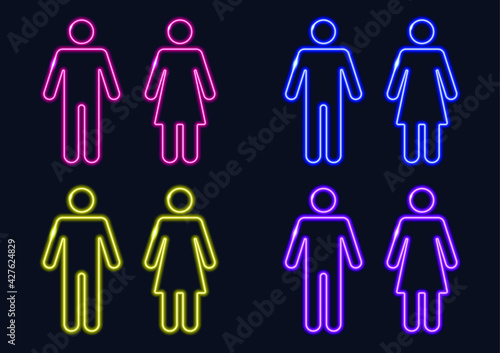 Male and female gender neon sign. Pointer to the toilet or bathroom. Glowing lines on a dark background.