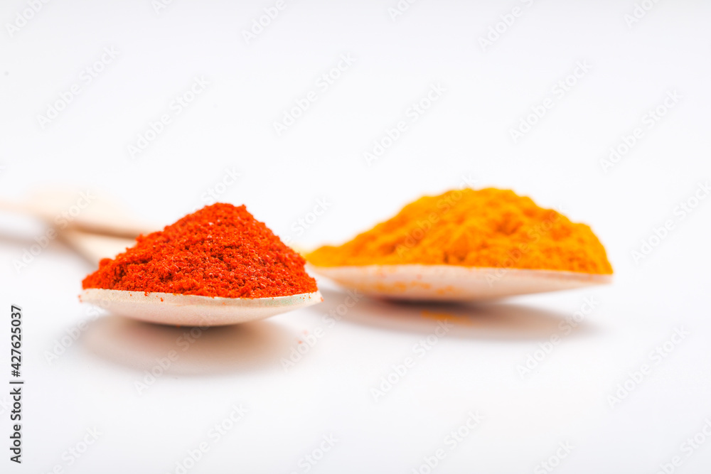 turmeric and chilly powder in spoon turmeric and chilly powder in spoon