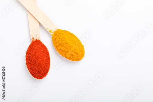 turmeric and chilly powder in spoon