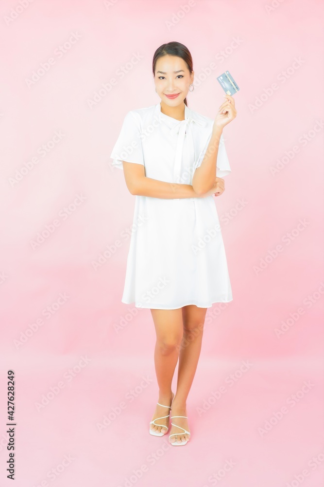Portrait beautiful young asian woman with credit card and shopping bag Portrait beautiful young asian woman with credit card and shopping bag