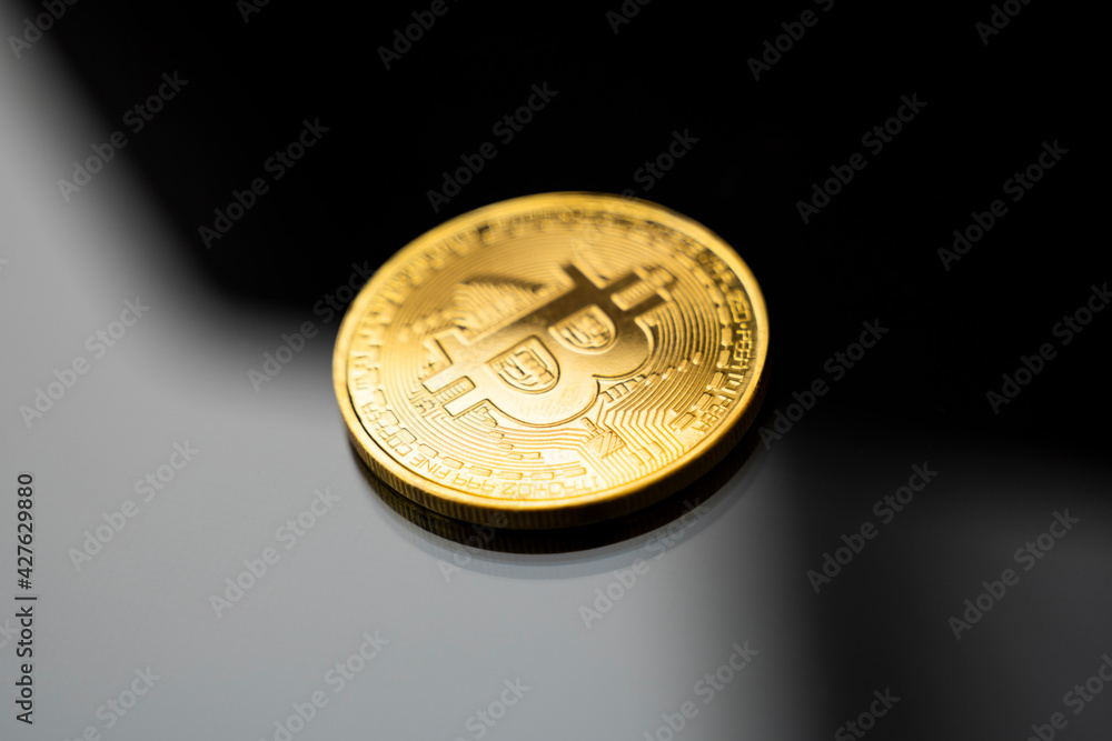 Gold bitcoin coin. Trading on the cryptocurrency exchange. Cryptocurrency Stock Market Concept. Virtual money concept. Mining or blockchain technology. Gold bitcoin coin. Trading on the cryptocurrency exchange. Cryptocurrency Stock Market Concept. Virtual money concept. Mining or blockchain technology.