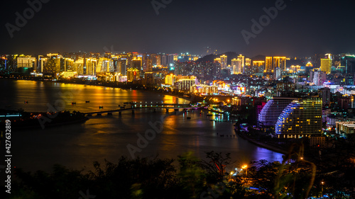 Sanya city nightscape with illuminated buildings in Sanya Hainan China