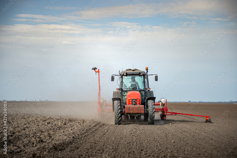 Sowing crops at agricultural fields in spring Sowing crops at agricultural fields in spring