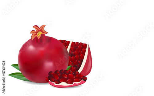 Halved pomegranate. Ripe pomegranates with leaves isolated on a white background.