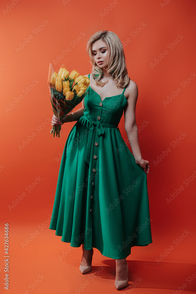 a blonde with tulips in her hand