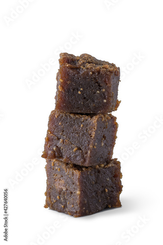 dodol isolated on white background, also called kalu dodol, sri lankan dark sweet candy, made from coconut milk, jaggery and rice flour, sticky, thick, sweet toffee