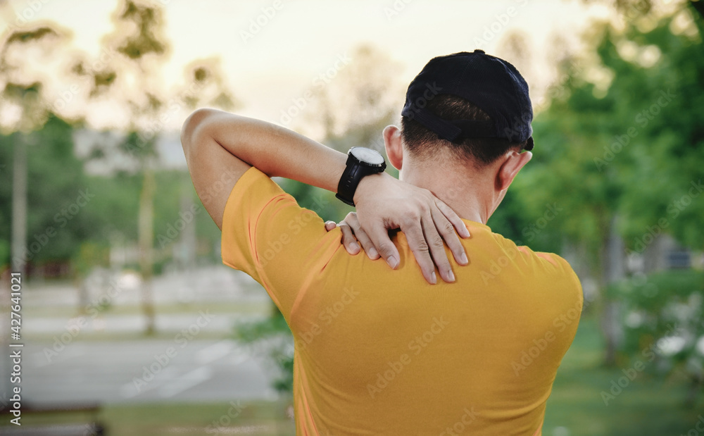 close up of young Asian sports man has pain at muscles and joints during outdoor exercise, over trainning or running and sport injuty concept close up of young Asian sports man has pain at muscles and joints during outdoor exercise, over trainning or running and sport injuty concept