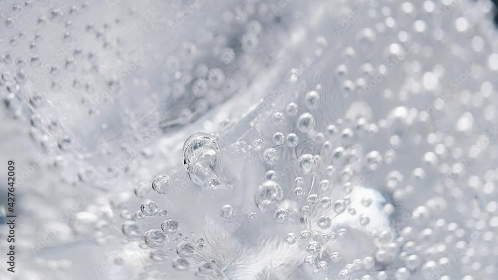 Ice in a glass of water. Macro. High quality 4k footage Ice in a glass of water. Macro. High quality 4k footage