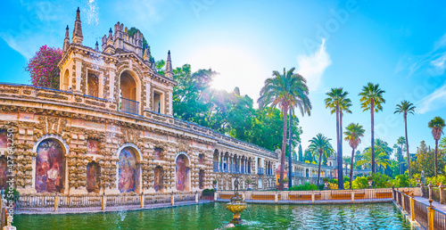 The pond and the Grotesque Gallery in Royal Alcazar Gardens in Seville, Spain photo