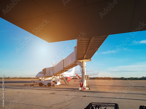 Jet bridge or aerobridge is connected to the aircraft’s door to the airport terminal, Boarding and disembarking passengers from an airplane.The aviation industry and logistics system in airport.