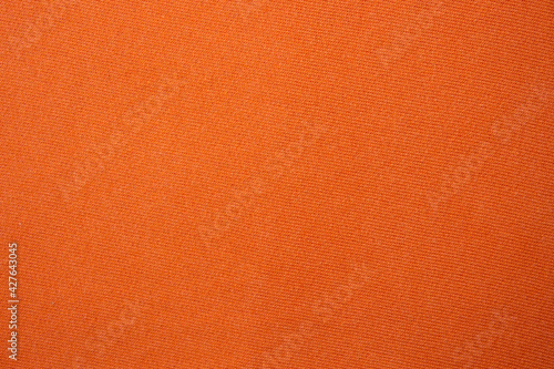close-up on orange cotton fabric cloth © thanasis