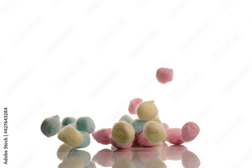 Colorful cotton make up balls, falling, isolated on white background. Colorful cotton make up balls, falling, isolated on white background.