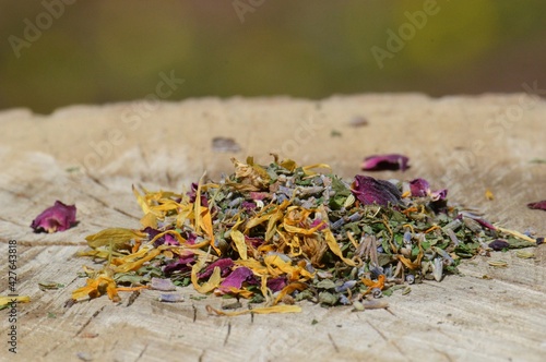 Dried herbs and flowers on a wooden stump