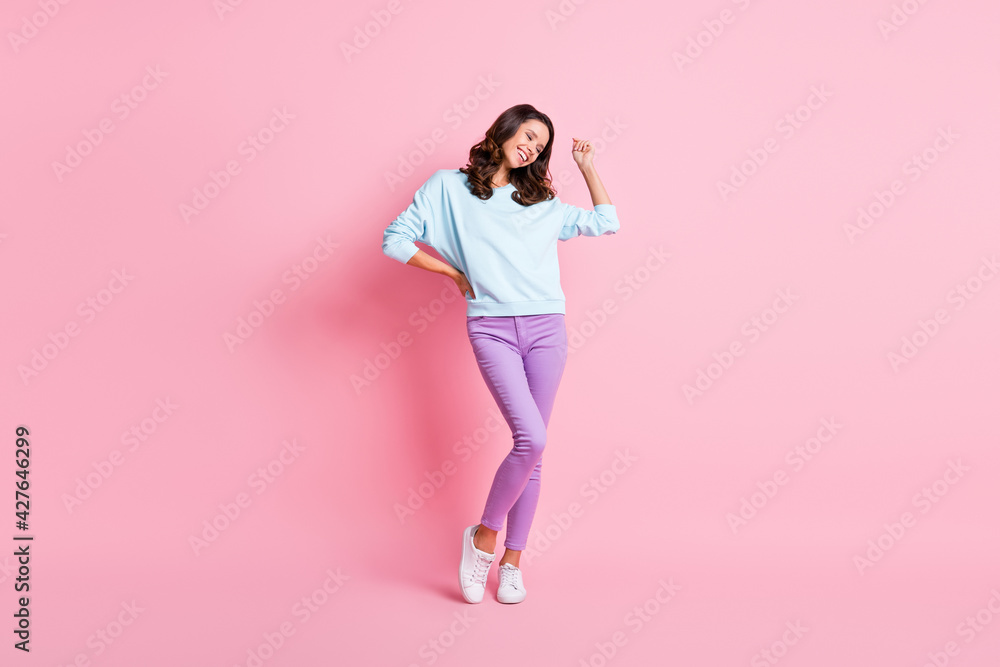 Full length body size view of pretty cheerful dreamy skinny wavy-haired girl having fun dancing isolated over pink pastel color background Full length body size view of pretty cheerful dreamy skinny wavy-haired girl having fun dancing isolated over pink pastel color background