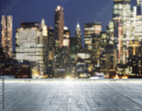Canvas Print Empty concrete dirty rooftop on the background of a beautiful blurry New York ci