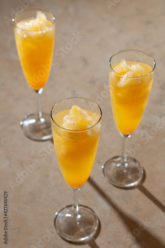 glass of orange juice and wine