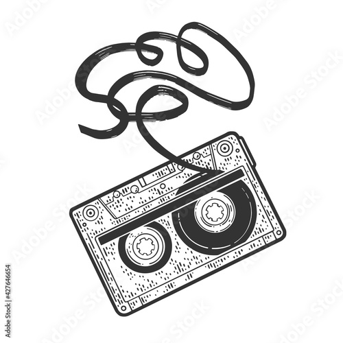 Cassette tape with tangled torn tape sketch engraving vector illustration. T-shirt apparel print design. Scratch board imitation. Black and white hand drawn image.