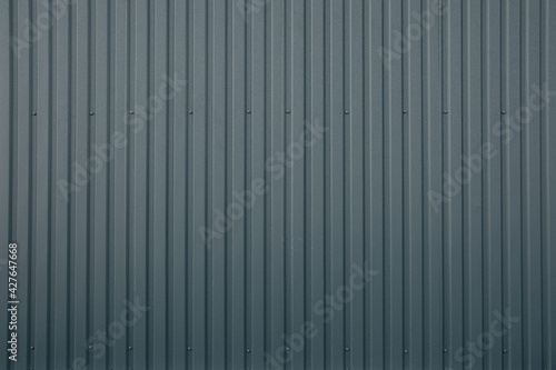 Gray striped metallic wall background.
