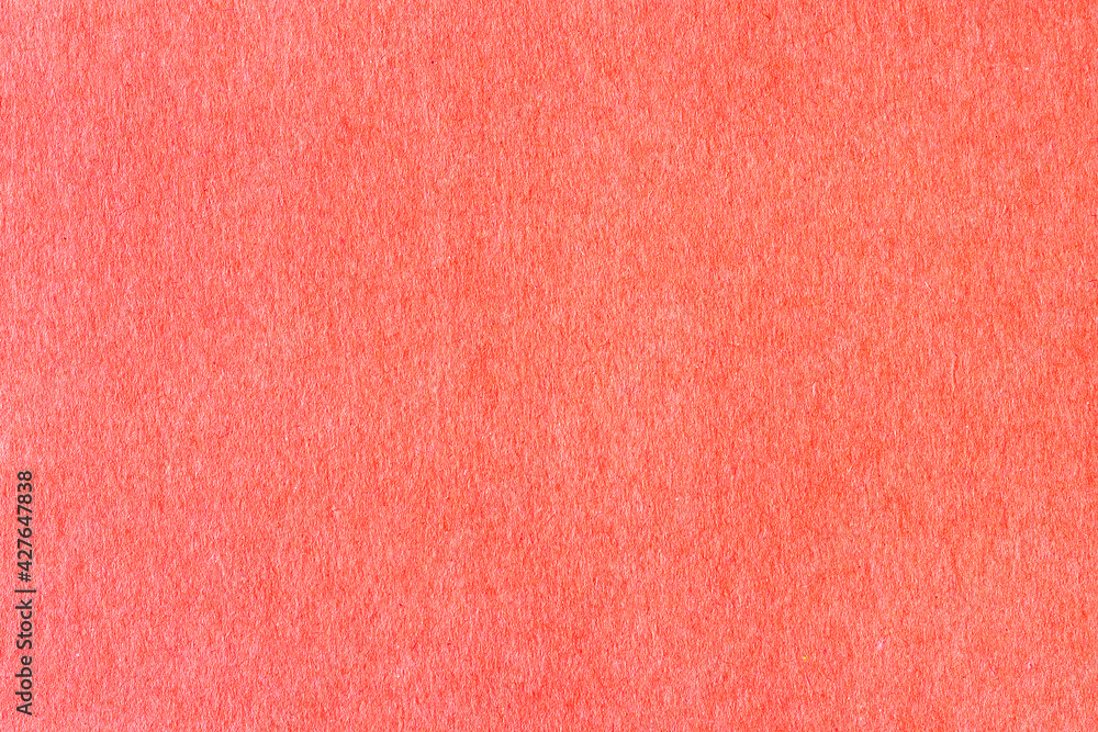 A sheet of red colored paper. Rough smooth texture. A sheet of red colored paper. Rough smooth texture.