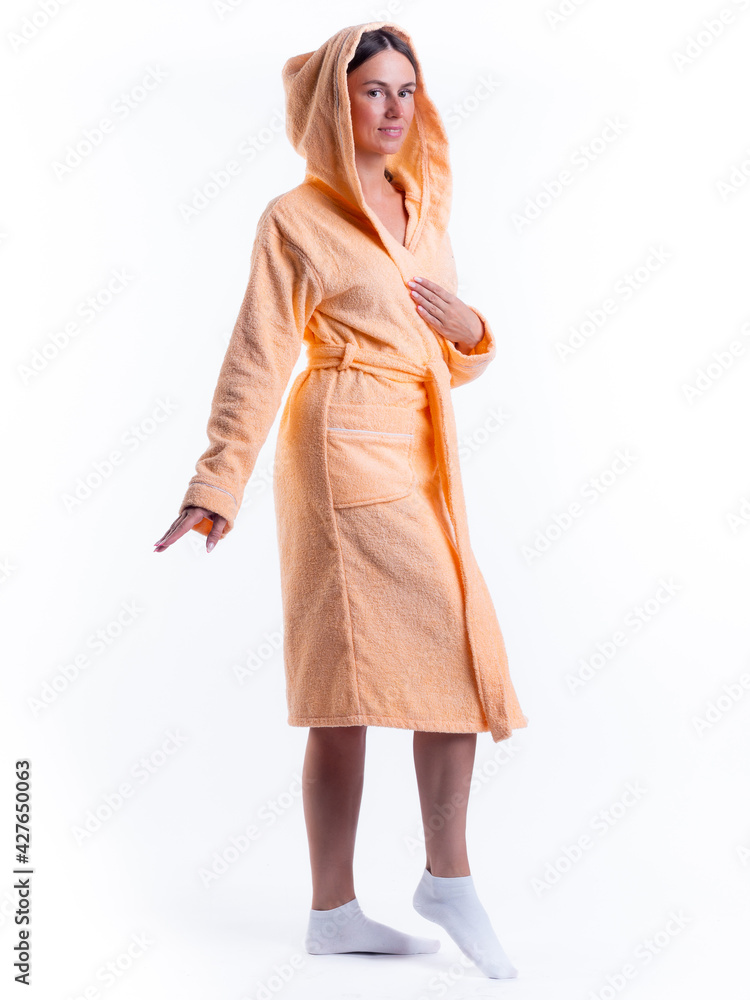 woman in a Bathrobe on an isolated white background with a smile on her face. woman in a Bathrobe on an isolated white background with a smile on her face.