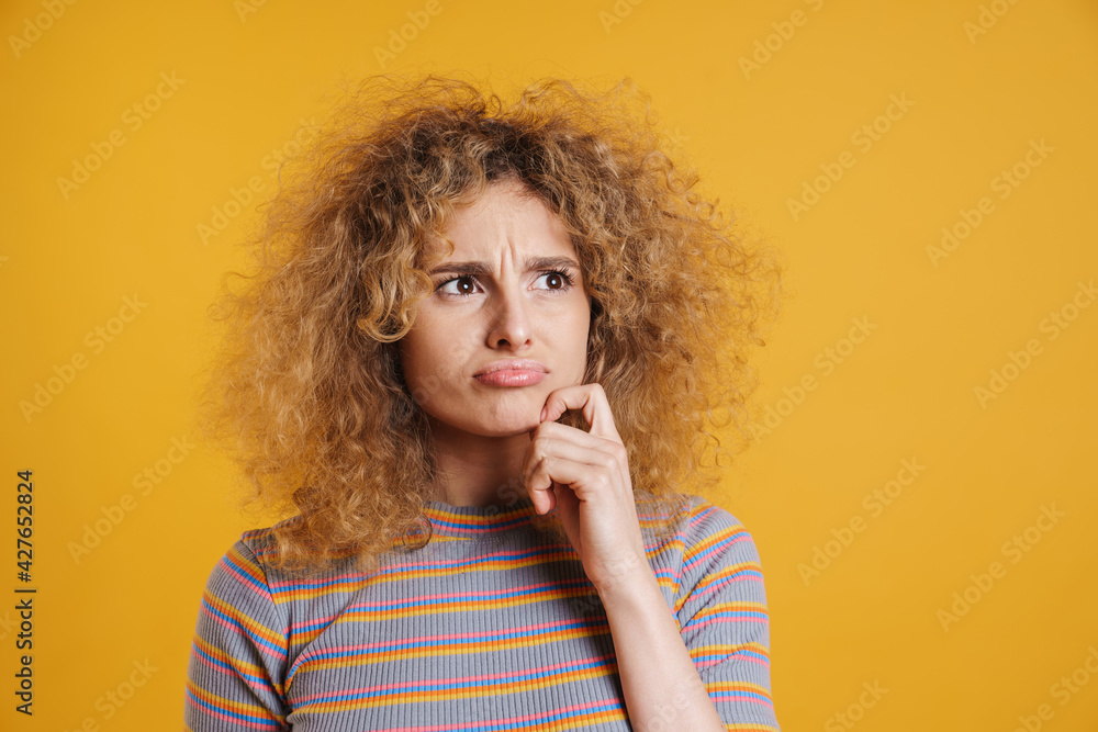 Happy young casual woman with fizzy hairstyle standing Happy young casual woman with fizzy hairstyle standing