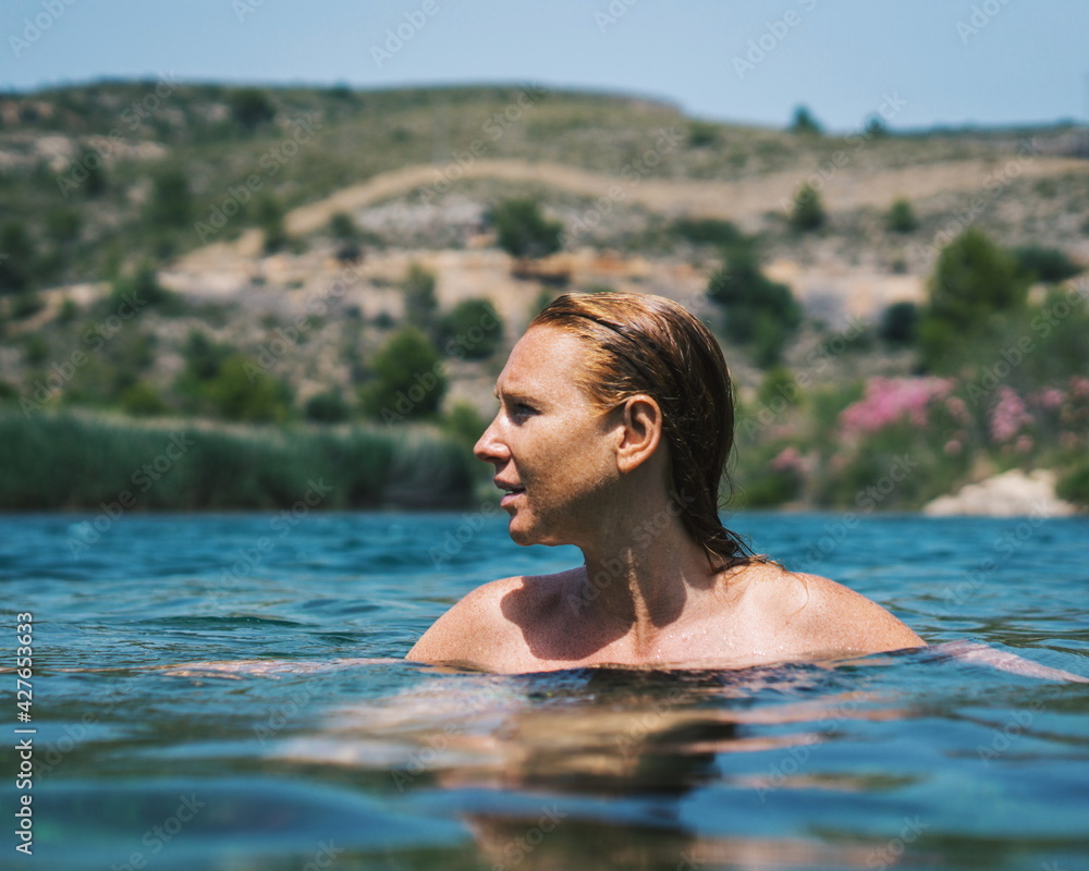woman swimming in a lake