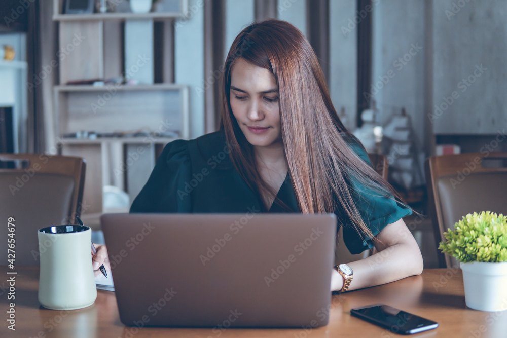 working women use computer laptop on desk, work from home concept, business women on desk working women use computer laptop on desk, work from home concept, business women on desk