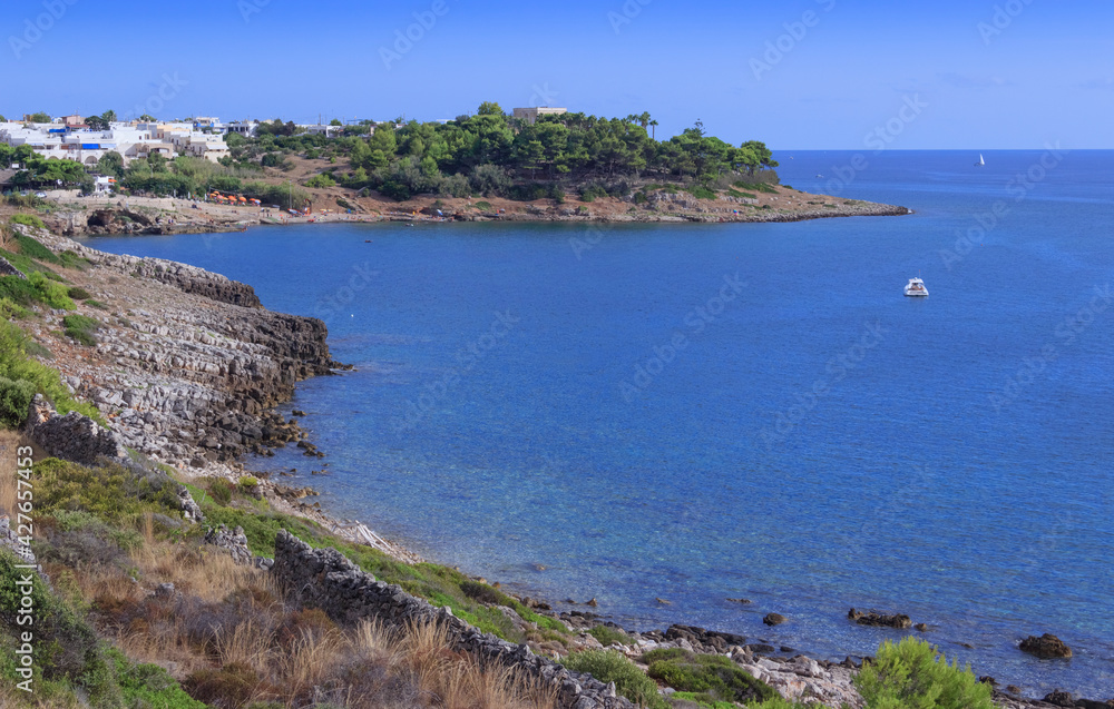 Fototapeta premium Marina San Gregorio, with its unspoiled sea beds, the blue sea and the rocky coast, offers an wonderful view along the coastline of Patù in Salento, Apulia (Italy).