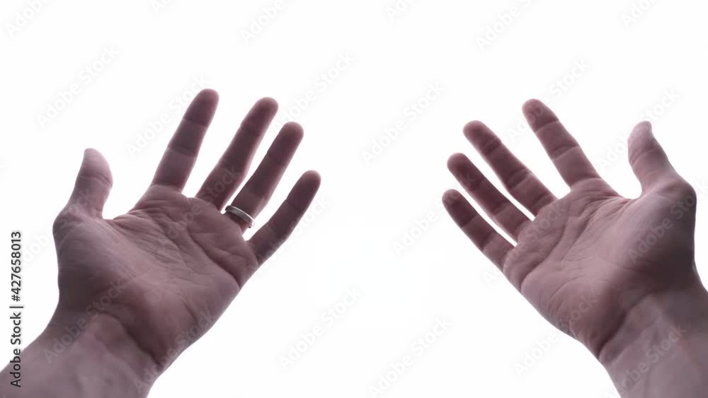 Man Showing Hands In White Background - close up, studio shot Man Showing Hands In White Background - close up, studio shot